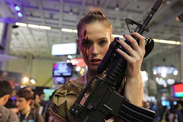 Cosplayer with rifle and bloody face makeup