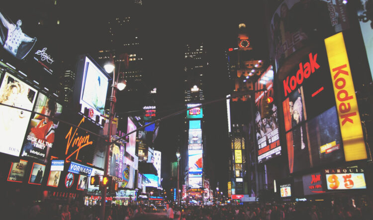 Times Square at night with neon billboards